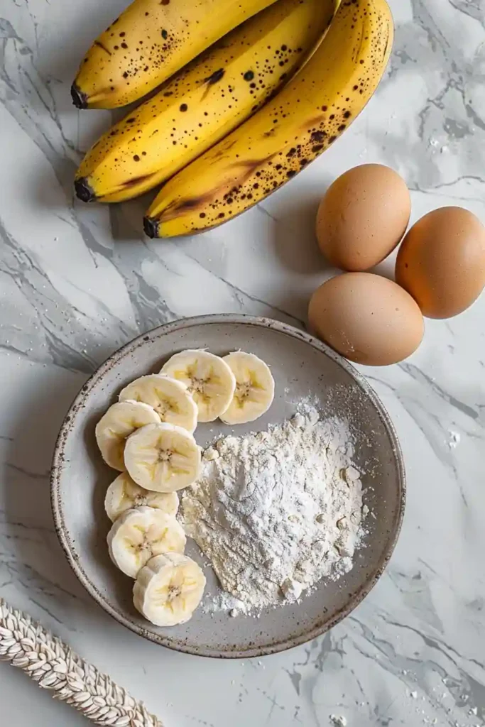 Stack of easy banana pancakes topped with syrup and fruit, ideal quick breakfast idea.