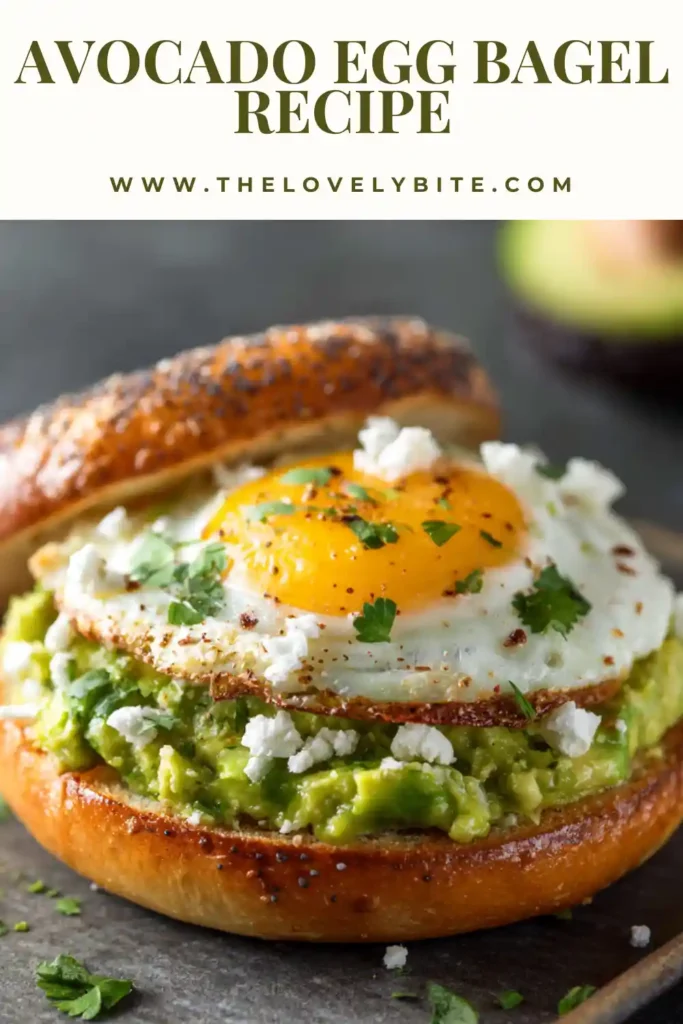 A toasted avocado egg bagel topped with creamy mashed avocado, soft cooked egg, crumbled feta cheese, and sweet chili sauce. This healthy breakfast bagel looks fresh, colorful, and satisfying.