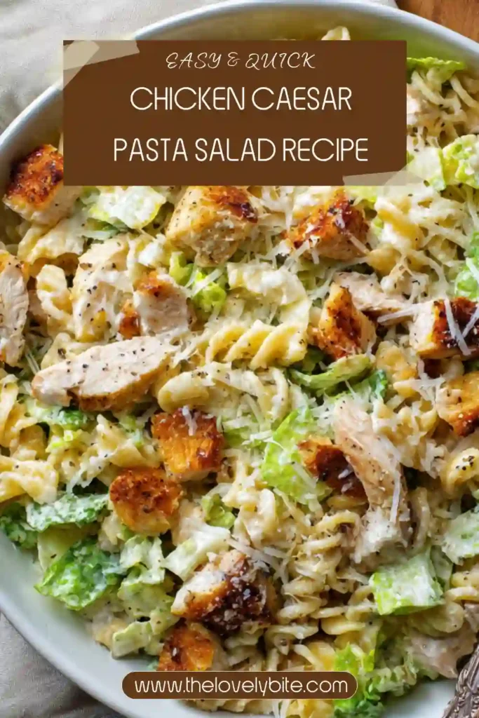 Creamy Chicken Caesar Pasta Salad served in a large bowl with tender chicken, crisp lettuce, Parmesan cheese, and pasta coated in homemade Caesar dressing. A delicious cold pasta salad recipe for summer meals.