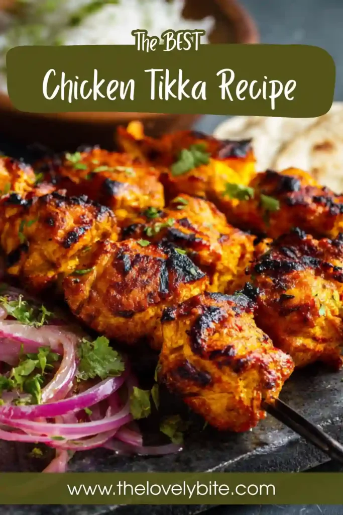 Freshly grilled chicken tikka arranged on skewers with lettuce and flatbread. The homemade chicken tikka has a rich golden color and smoky finish.