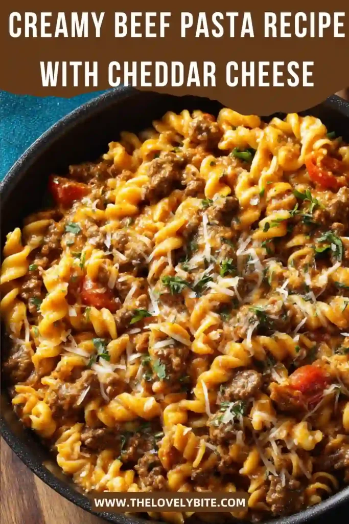 Homemade creamy rotini pasta with seasoned beef and cheddar cheese in a rich sauce. Fresh parsley adds a vibrant finishing touch.