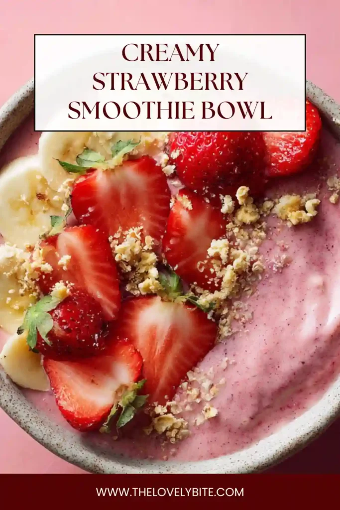 Close-up of a creamy strawberry smoothie bowl with hemp seeds and sliced strawberries. The vibrant pink color highlights its fresh fruit ingredients.