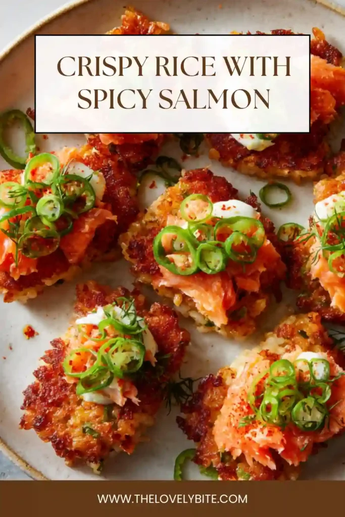 Homemade crispy rice topped with spicy salmon and garnished with green onions and sesame seeds. Vibrant and flavorful dish.
