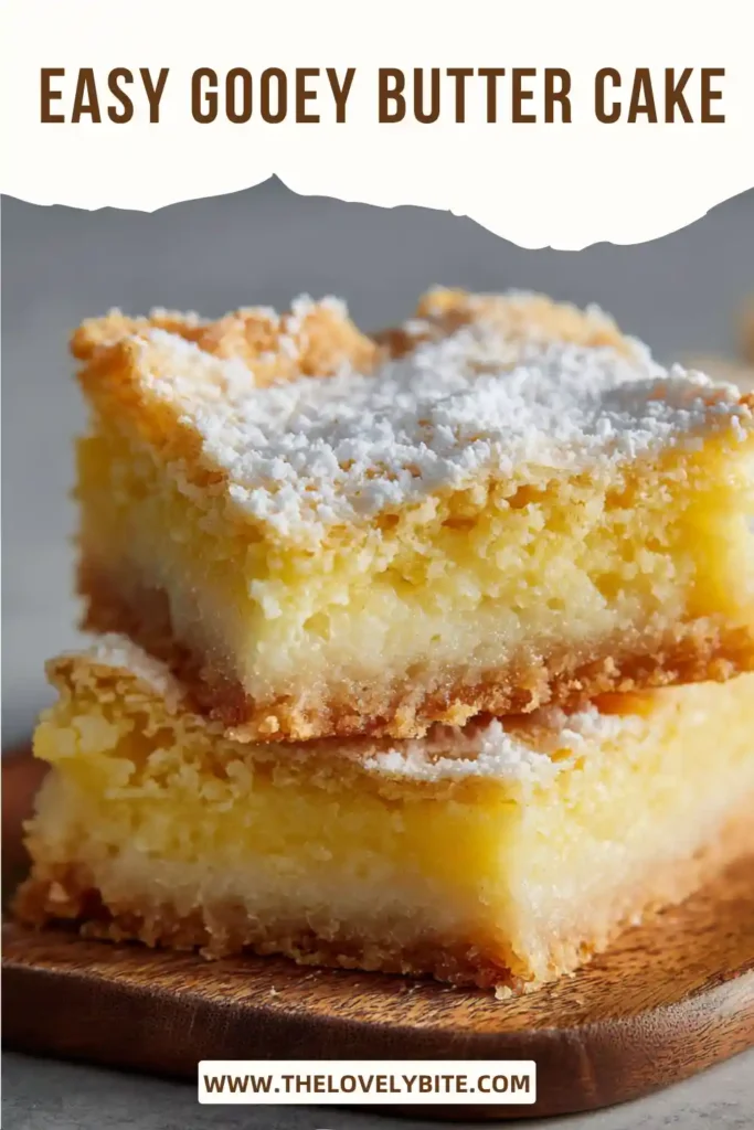 Easy Gooey Butter Cake sliced into squares with powdered sugar dusted over the top. The dessert has a rich buttery crust and creamy gooey center.