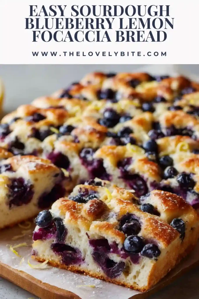 A close-up of blueberry lemon focaccia with golden crust, fresh berries, and citrus glaze. This sourdough focaccia bread looks soft, fluffy, and flavorful.