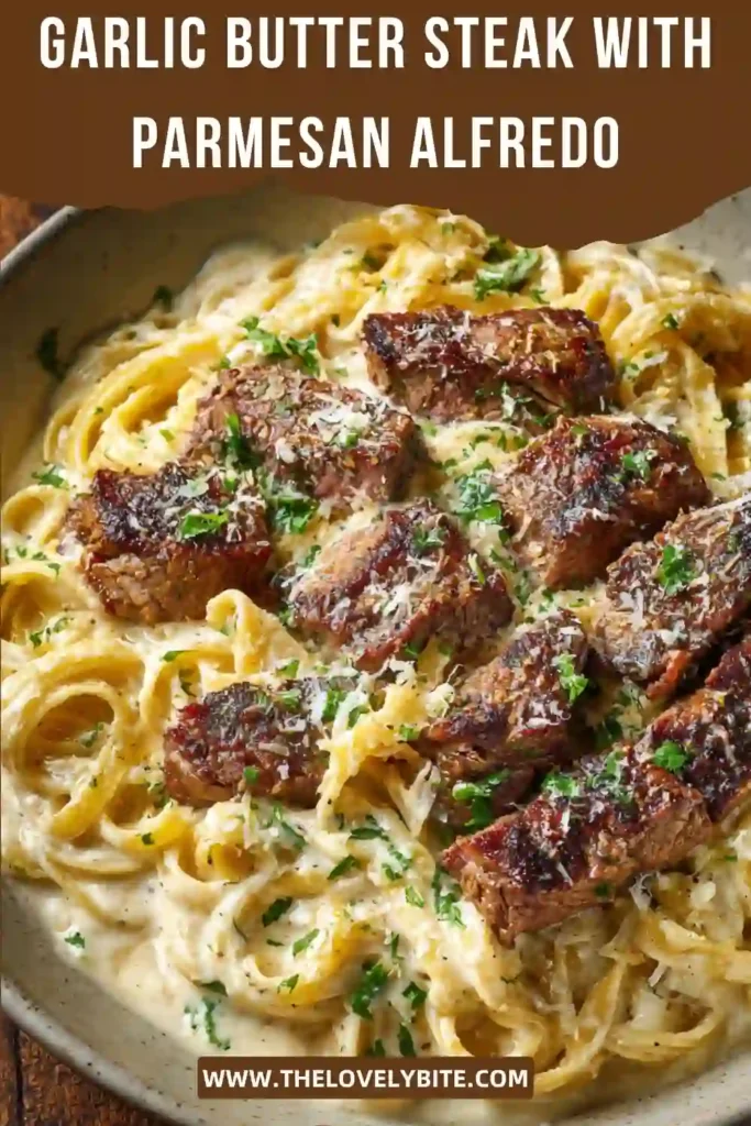 Close-up of Garlic Butter Steak with Parmesan Alfredo featuring tender steak pieces over creamy fettuccine Alfredo pasta. The homemade parmesan sauce creates a rich and comforting meal.