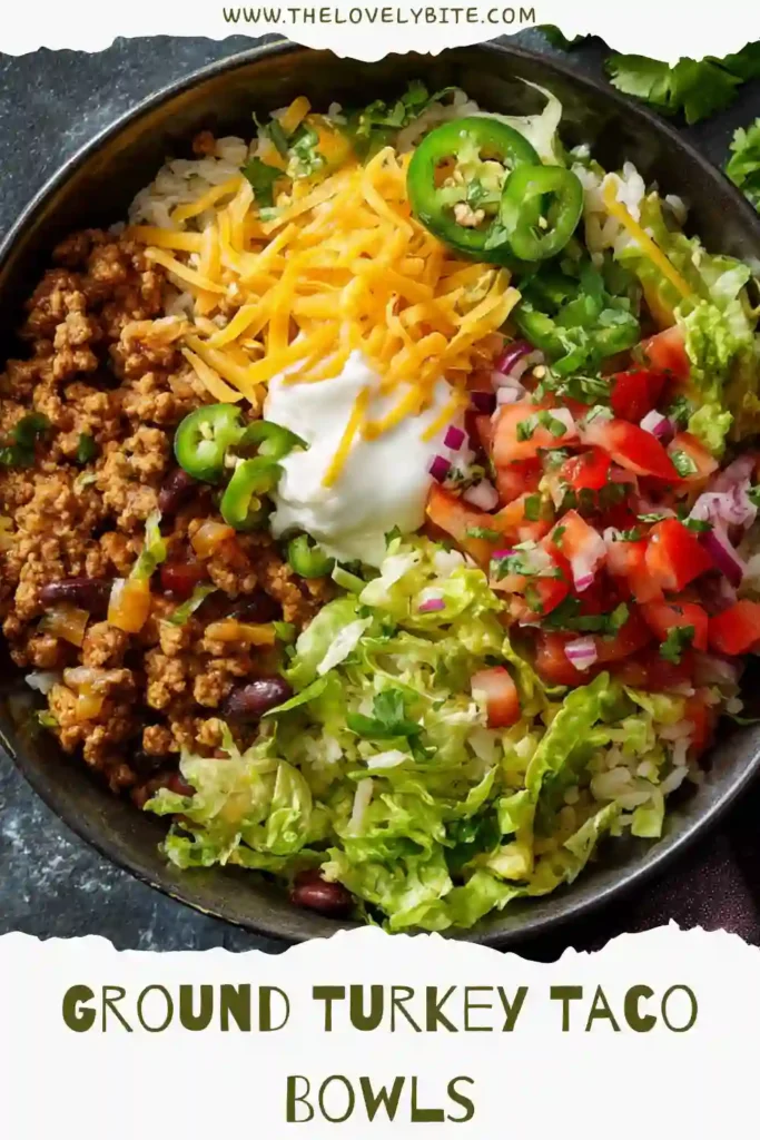 Close-up of Ground Turkey Taco Bowls featuring seasoned lean turkey over rice with fresh toppings and lime wedges. This easy taco bowl recipe is ideal for meal prep and busy family dinners.