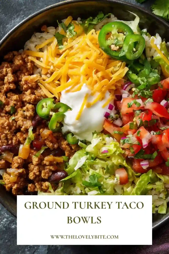 Tex-Mex Ground Turkey Taco Bowls layered with rice, black beans, shredded lettuce, tomatoes, and creamy guacamole. A simple and satisfying healthy dinner recipe full of bold flavor.