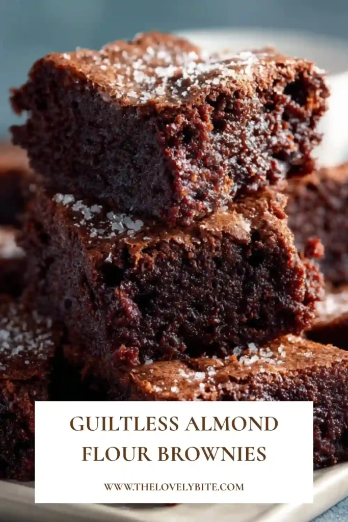 Close-up of homemade almond flour brownies with a soft fudgy center and crisp edges. The healthy chocolate brownies are made with almond flour and cocoa powder.