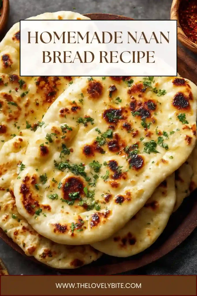 Close-up of fluffy Homemade Naan Bread topped with melted butter and herbs. The skillet naan has a tender texture and lightly charred finish.