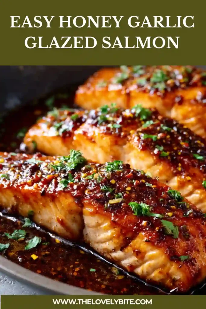 Easy Honey Garlic Glazed Salmon plated with lemon wedges and herbs for a quick weeknight dinner. The salmon is glazed with garlic butter sauce and cooked until flaky.
