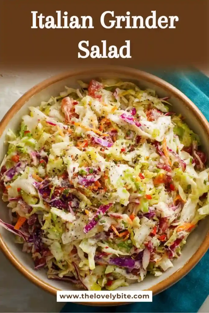 Colorful chopped sub salad with turkey, pepperoni, tomatoes, banana peppers, and creamy oregano dressing ready for serving.