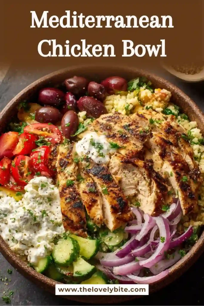 Greek-inspired Mediterranean Chicken Bowl served with fluffy couscous, chickpeas, cucumbers, tomatoes, feta cheese, and creamy tzatziki. The dish is balanced, colorful, and perfect for meal prep.