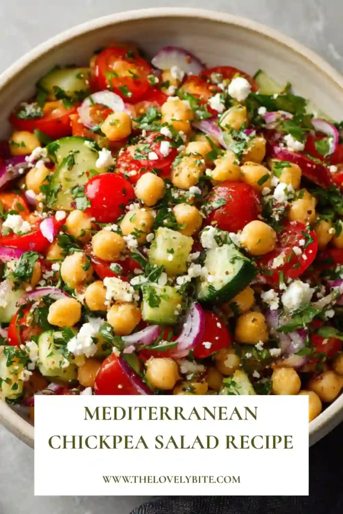 A fresh bowl of Mediterranean Chickpea Salad with colorful vegetables and creamy feta cheese tossed in homemade lemon vinaigrette. This protein-packed salad is ideal for a quick healthy meal.