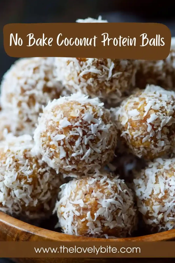 A plate of No Bake Coconut Protein Balls coated in unsweetened coconut flakes with visible chocolate chips throughout. These healthy protein bites are made with dates, almonds, and cacao powder.