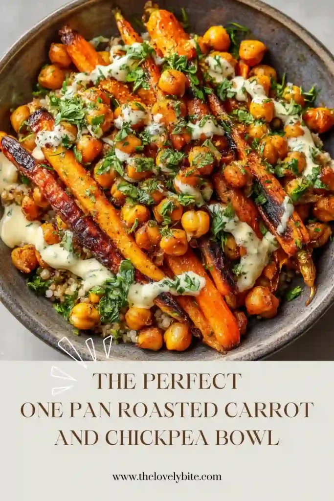 Close-up of a One Pan Roasted Carrot and Chickpea Bowl topped with lemon tahini dressing and fresh herbs. The roasted vegetables appear caramelized and vibrant.