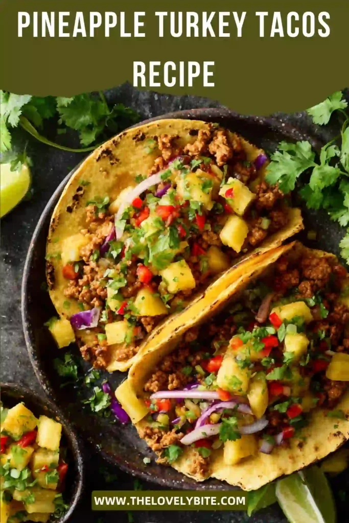 Close-up of homemade Pineapple Turkey Tacos topped with diced bell peppers, avocado, and cilantro. The sweet pineapple and savory turkey filling create a delicious high-protein meal.
