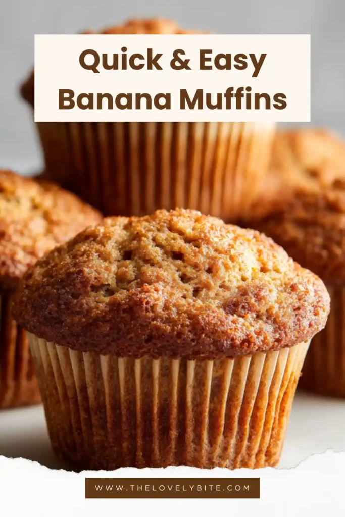 A batch of fluffy banana muffins with chocolate chips served warm. These easy banana muffins are golden brown and bakery-style.