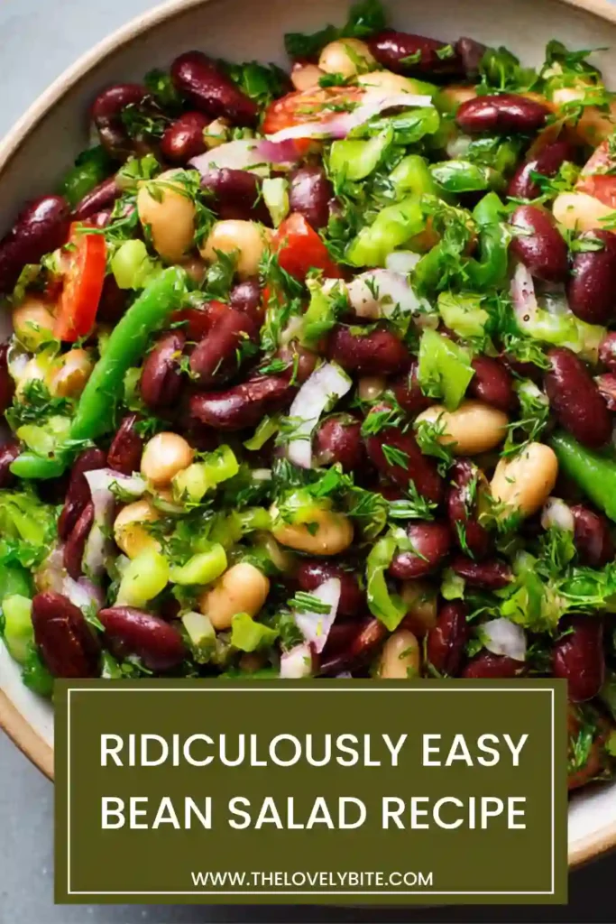 A bowl of Ridiculously Easy Bean Salad filled with colorful mixed beans, chopped cucumber, parsley, and capers tossed in a tangy vinaigrette. This healthy bean salad is fresh, vibrant, and perfect for meal prep.