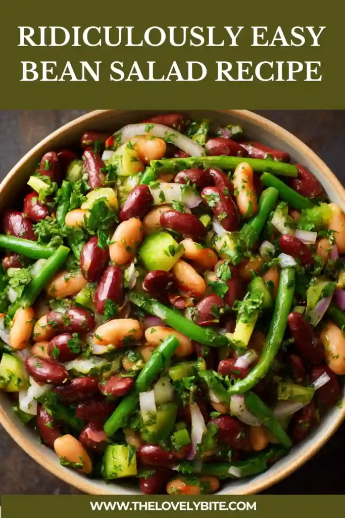 Close-up of easy bean salad made with mixed beans, fresh herbs, cucumbers, and olive oil dressing. This cold bean salad is packed with texture and bright flavor.