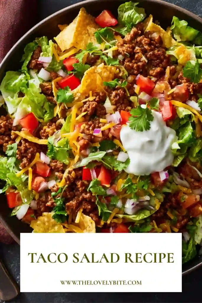 Fresh Best Taco Salad topped with seasoned beef, black beans, juicy tomatoes, shredded cheese, and crispy tortilla strips in a large serving bowl. A delicious Tex-Mex salad recipe with bold flavors and crunchy textures.