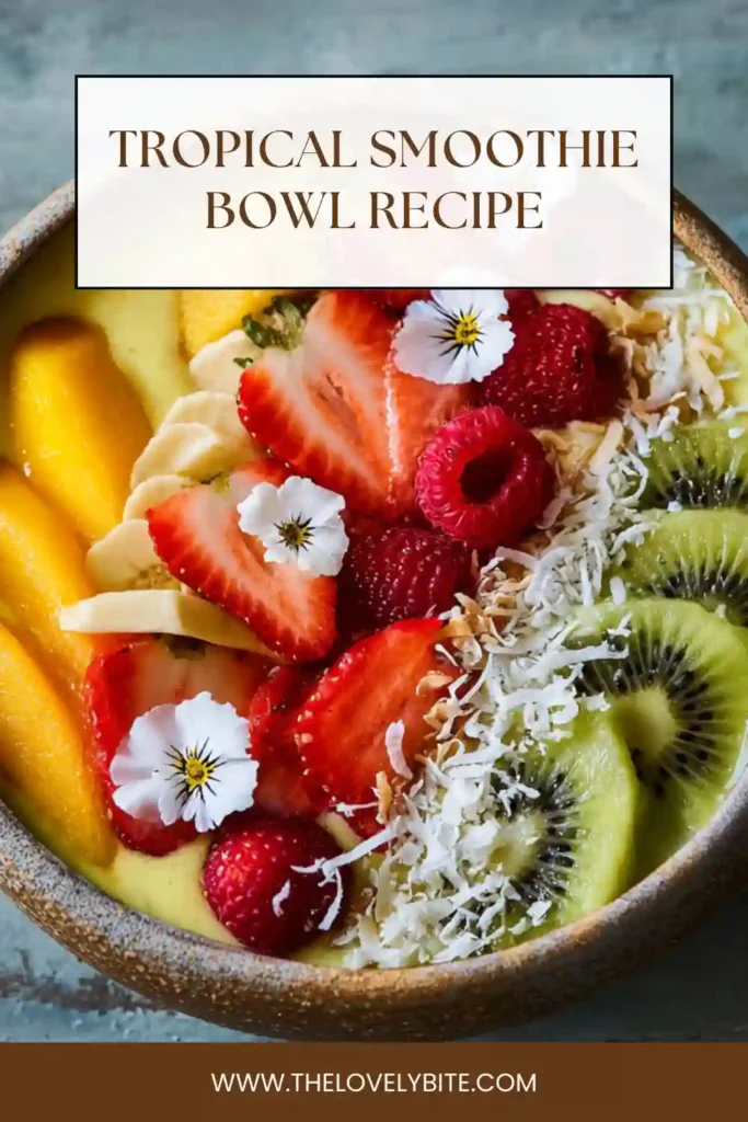 Healthy Tropical Smoothie Bowl in a white bowl topped with pineapple, raspberries, coconut flakes, and kiwi slices. A refreshing dairy-free breakfast made with frozen fruit.