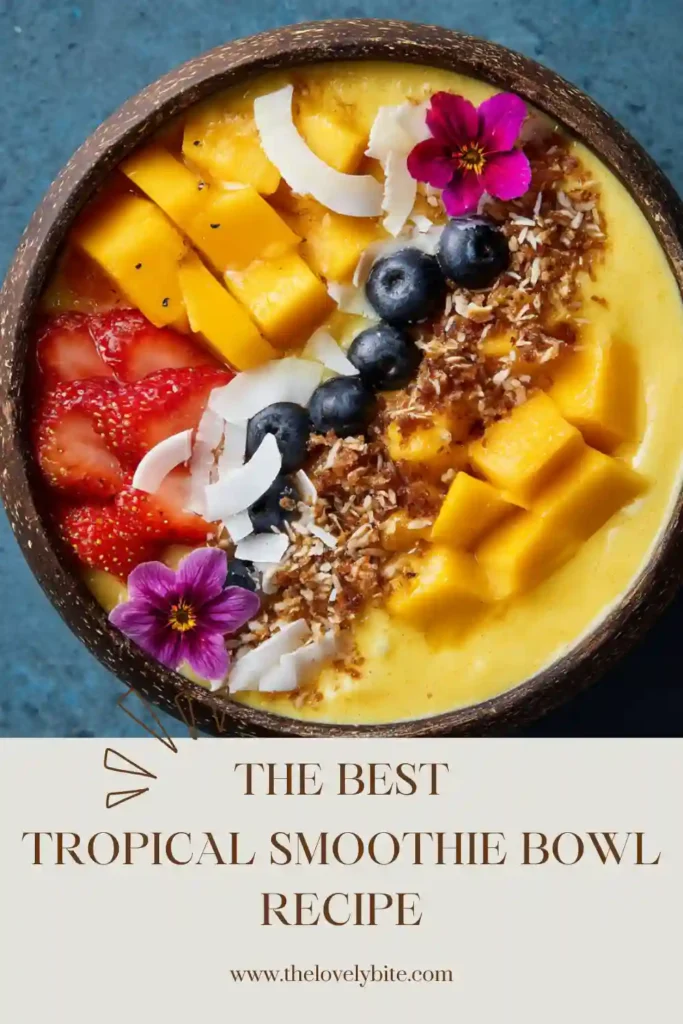 Refreshing Tropical Smoothie Bowl with vibrant fruit toppings and creamy mango strawberry smoothie base. Perfect healthy breakfast idea for summer mornings.