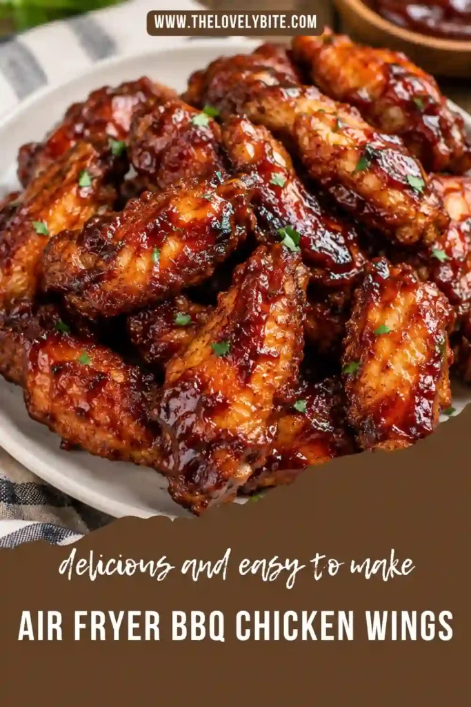 Homemade Air Fryer BBQ Chicken Wings arranged on a serving plate with barbecue dipping sauce. The crispy wings feature a caramelized BBQ coating and tender meat inside.