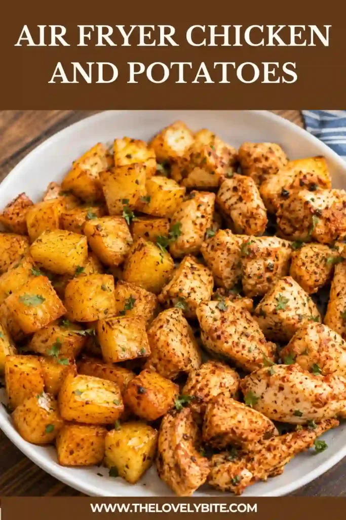 Golden roasted potatoes and seasoned chicken breast cooked together in an air fryer basket. Fresh parsley adds color and freshness to this quick weeknight meal.