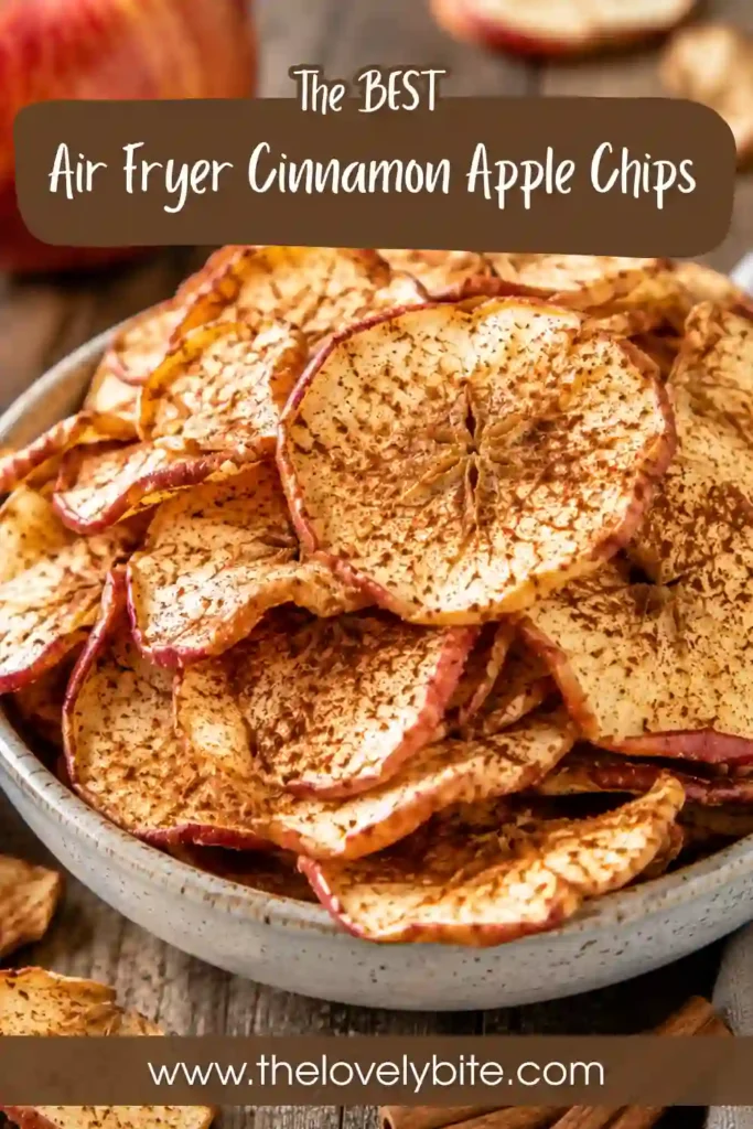 Thin slices of homemade Air Fryer Cinnamon Apple Chips are cooling after cooking until perfectly crisp. The healthy air fryer snack features fresh apples and aromatic cinnamon.