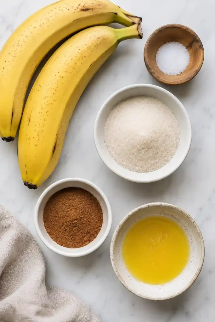 A bowl filled with homemade Air Fryer Cinnamon Banana Chips featuring golden edges and a crisp cinnamon coating. The snack is naturally sweet and made with fresh bananas.