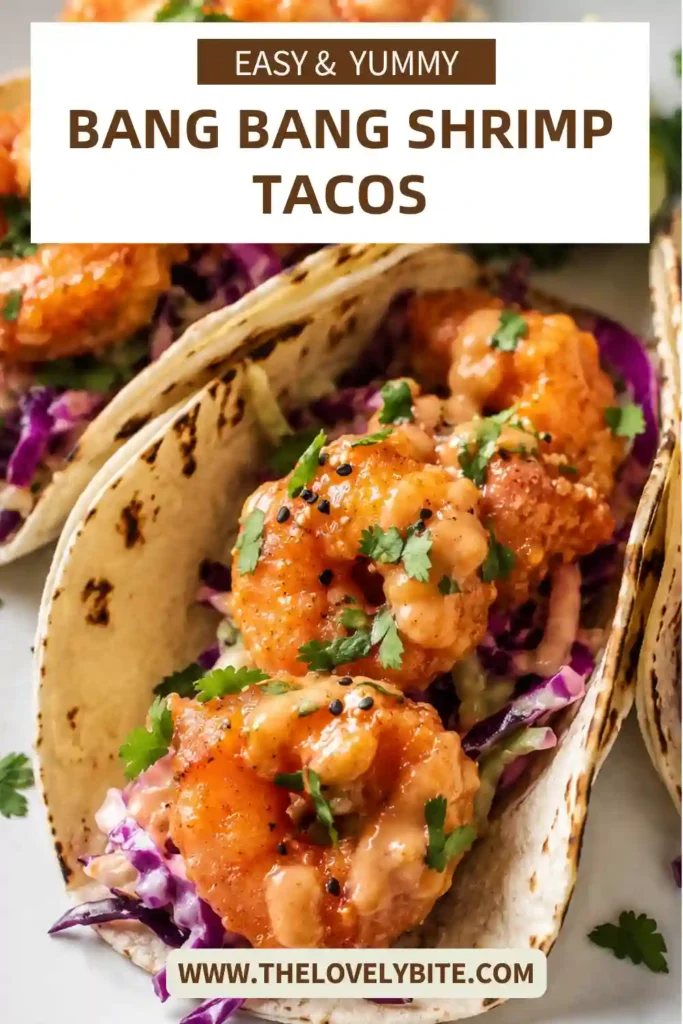 Homemade Bang Bang Shrimp Tacos featuring crispy dynamite shrimp, creamy spicy sauce, and vibrant fresh toppings. Served fresh with cilantro and lime.