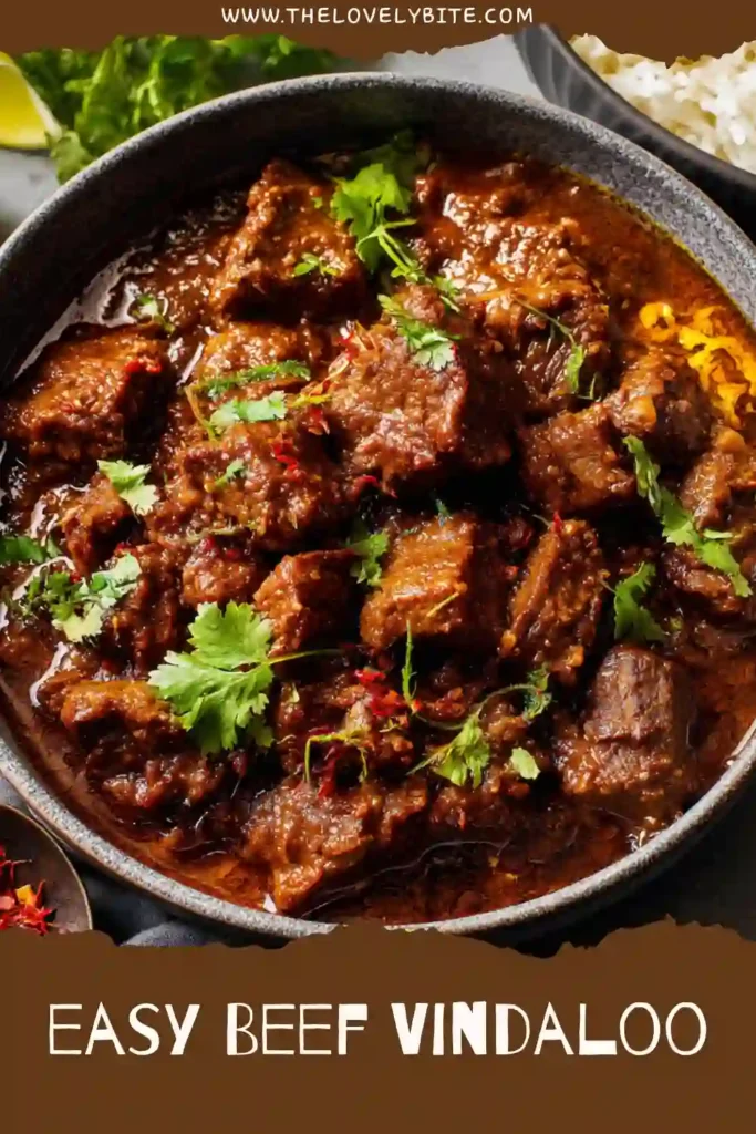 Close-up view of Beef Vindaloo showcasing tender chunks of beef in a vibrant curry sauce. A comforting and flavorful dinner recipe.
