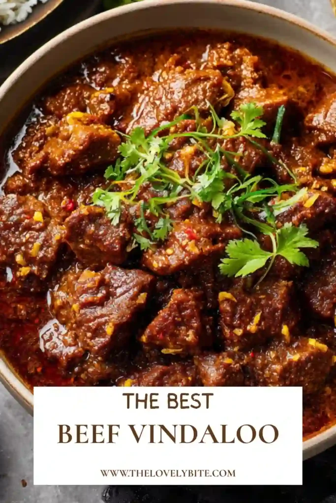 Authentic-style Beef Vindaloo prepared with aromatic spices, vinegar, and beef chuck. Served alongside basmati rice for a complete meal.
