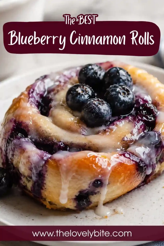 Homemade Blueberry Cinnamon Rolls served warm with rich cream cheese icing. Fluffy dough and fresh blueberry filling create a beautiful breakfast pastry.