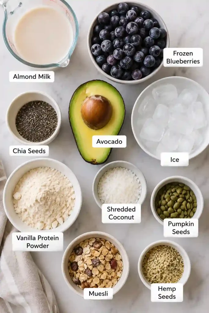 Healthy Blueberry Protein Smoothie Bowl made with frozen blueberries, chia seeds, avocado, and almond milk, beautifully garnished with wholesome toppings.