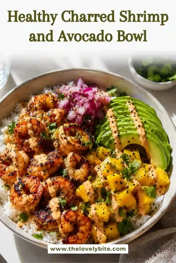 Fresh shrimp rice bowl featuring charred shrimp, diced mango salsa, avocado, and cilantro over steamed rice. Bright colors and bold flavors make this healthy seafood meal stand out.