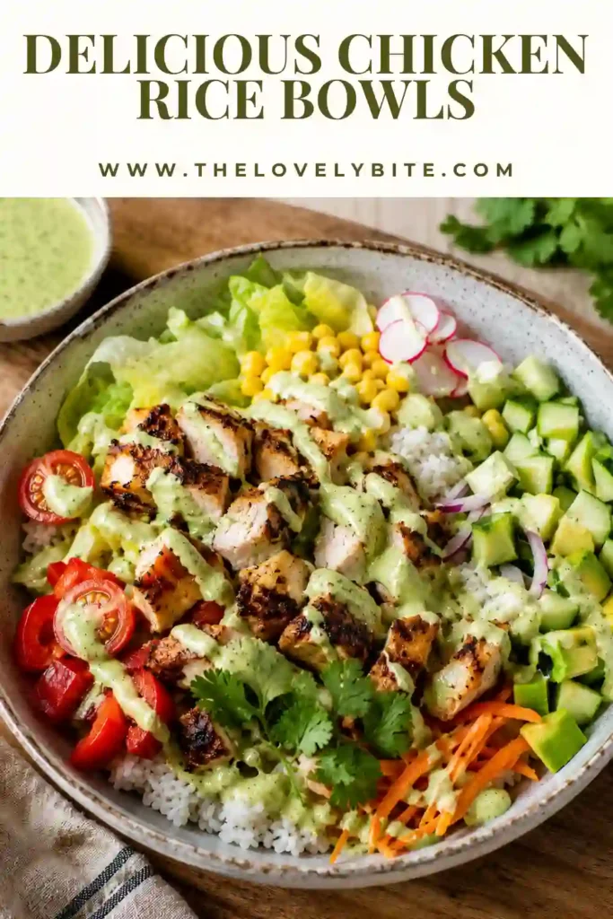 A colorful Chicken Rice Bowl filled with juicy seasoned chicken, fluffy jasmine rice, avocado, cucumber, carrots, corn, and creamy cilantro lime sauce. A healthy and satisfying meal prep recipe.