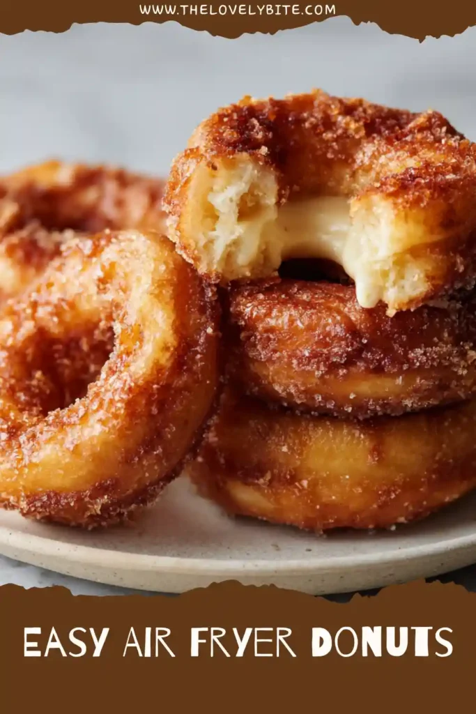 Golden Easy Air Fryer Donuts made from biscuit dough and rolled in cinnamon sugar. A simple family-friendly treat with a soft, fluffy texture.