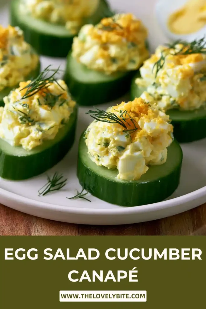 Homemade Egg Salad Cucumber Canapés arranged on a white platter for a party appetizer spread.