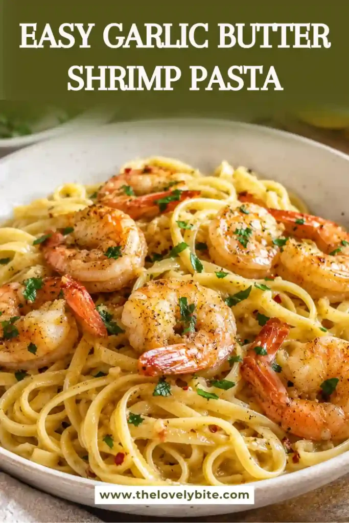 Close-up view of homemade Garlic Butter Shrimp Pasta served in a white bowl. Juicy shrimp and buttery noodles are tossed with Parmesan and herbs.