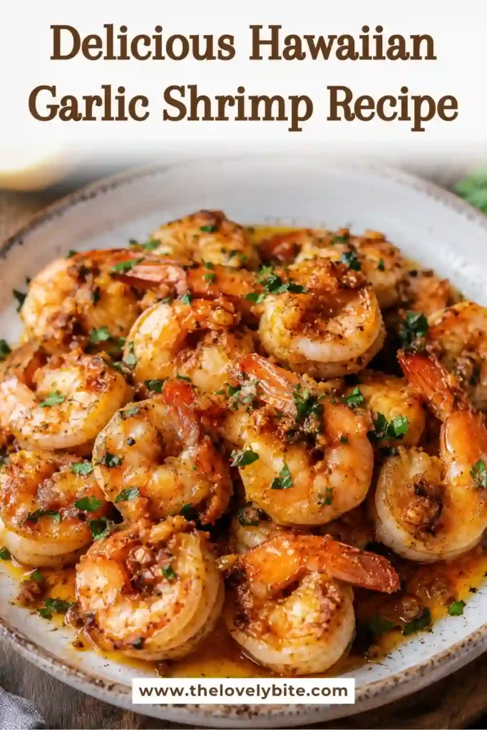 A skillet filled with Hawaiian Garlic Shrimp cooked in garlic butter sauce with fresh lemon and parsley. Perfect for a quick weeknight seafood recipe.