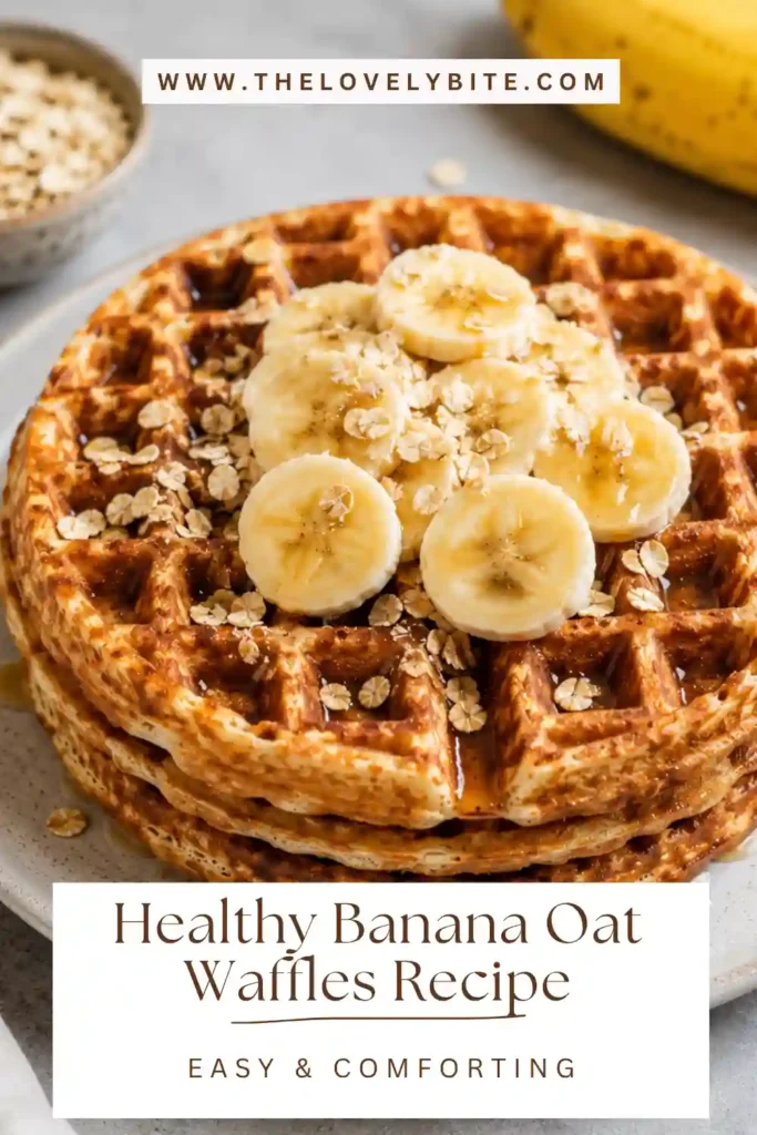 Golden brown banana oat waffles served warm with fresh fruit. A healthy breakfast recipe made from blended oats, bananas, and almond milk.