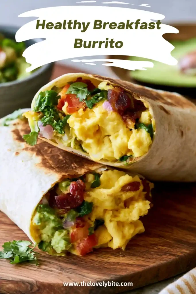 Breakfast Burrito wrapped in foil and cut in half to reveal eggs, black beans, potatoes, avocado, and fresh cilantro.