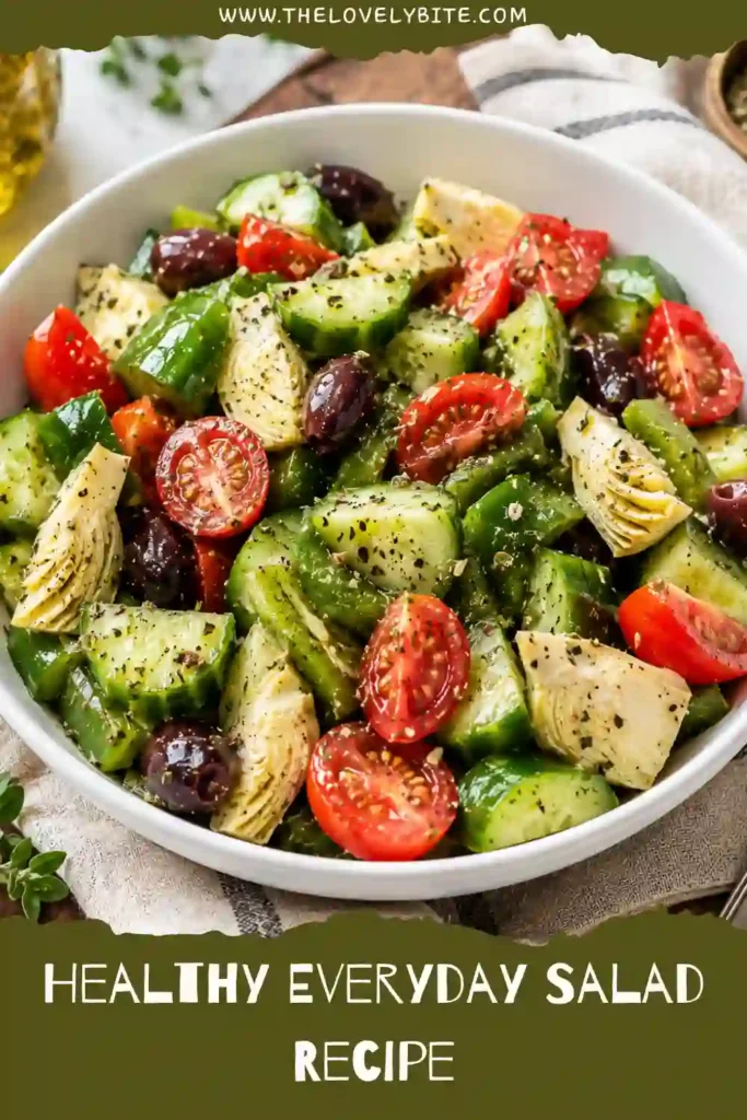 Close-up of a healthy salad recipe with crisp cucumber, tomatoes, avocado, scallions, and olives. This easy salad recipe is vibrant, refreshing, and full of wholesome ingredients.