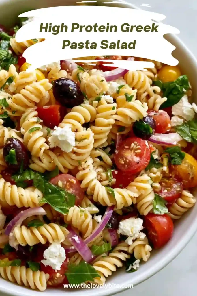 Healthy Greek pasta salad served cold with cucumbers, tomatoes, peppers, and feta cheese. Protein pasta adds extra nutrition and makes this salad ideal for meal prep.