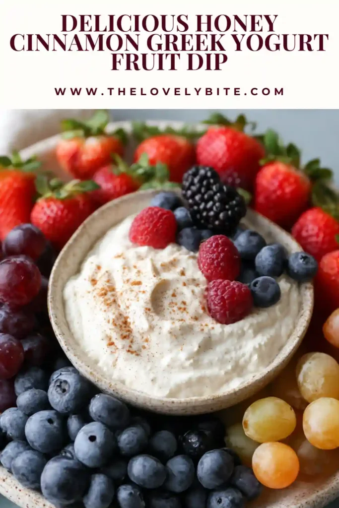 Creamy cinnamon honey yogurt dip in a bowl surrounded by colorful fresh fruit. An easy Greek yogurt dip recipe for healthy snacking.
