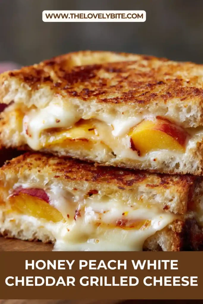 Sweet and savory peach grilled cheese sandwich served warm with melted cheddar cheese.