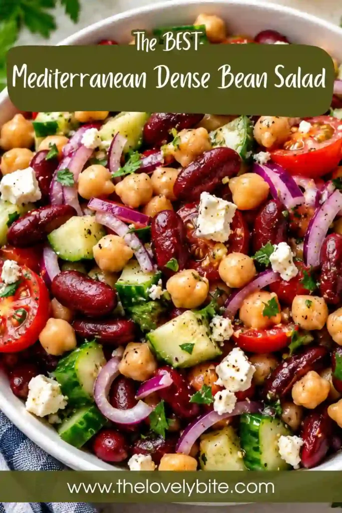 Healthy Mediterranean Dense Bean Salad served in a large bowl with fresh vegetables, protein-packed beans, feta cheese, and homemade lemon herb dressing. An easy and refreshing salad for lunch or dinner.