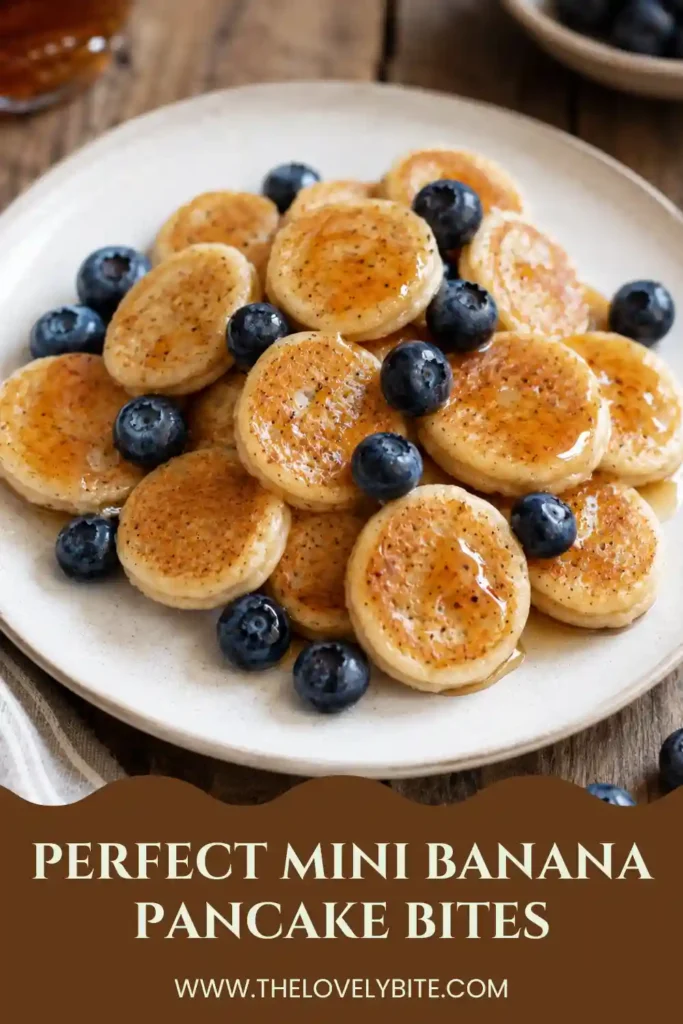 Homemade Mini Banana Pancake Bites arranged on a serving plate with maple syrup. Soft bananas wrapped in fluffy pancake batter create the perfect breakfast snack.